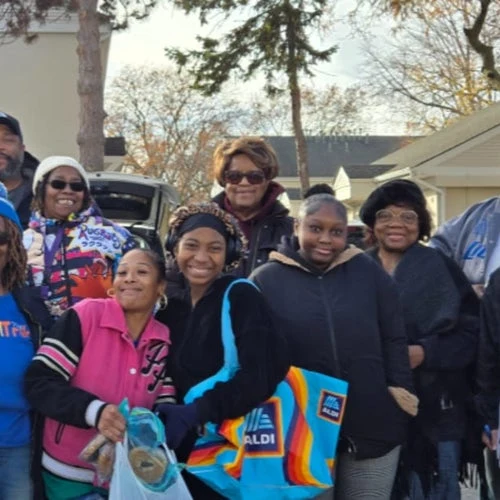 Greater Ecclesia Temple families gathering outdoors during a neighborhood outreach event